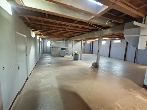 a large empty space with several drywalls and cabinets,hallway space,basement,commercial hvac,mezzanine,renovation,taproom,Photography,General,Realistic