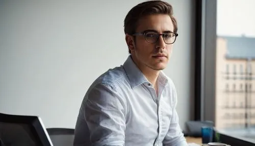 Modern architectural design planner, online platform, 30s male, bespectacled, short brown hair, casual wear, white shirt, dark blue jeans, sneakers, sitting, ergonomic chair, desktop computer, large m