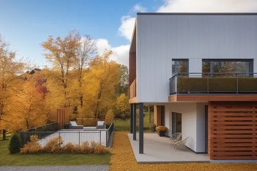 a white house sitting on top of a lush green field,passivhaus,modern house,cubic house,modern architecture,lohaus,timber house