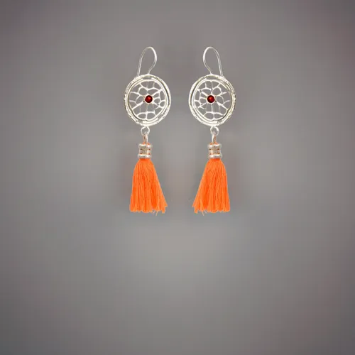 wo earrings lie on a white background, top view of the earrings,christmas tassel bunting,traffic cones,jewelry florets,tassel,earrings,tennis racket accessory,watercolor tassels,tassels,wind chimes,te