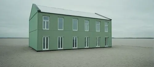 a two story green house sitting on top of a sandy beach,cube stilt houses,beach house,cube house,cubic house,beachhouse,danish house,Photography,Documentary Photography,Documentary Photography 04