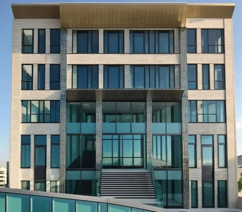 modern commercial office building with stone glazing facade glass curtain wall,metal surface with geometric pattern ,an exterior s of a large building with glass panels,rotana,baladiyat,modern buildin