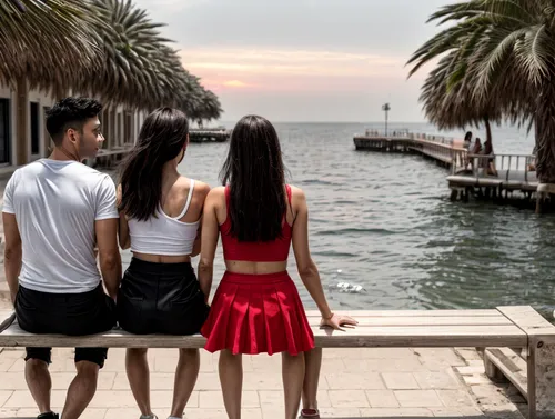 They sit together on a bench in front of the sea.  Looking at the sunset.,fisher island,on the pier,baywalk,trabocchi,eilat,clearwater beach,darling harbor,board walk,fremantle,sentosa beach,xiamen,ha