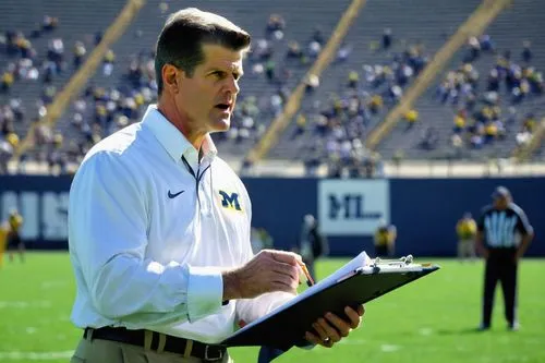 american football coach,head coach,young coach,football coach,tom collins,o'leary,listening to coach,down-the-hole drill,coaching,athletic trainer,coach,foley,butler,clipboard,jordan fields,gameplan,bo leaves,coaches,buckeyes,field west,Photography,Documentary Photography,Documentary Photography 13