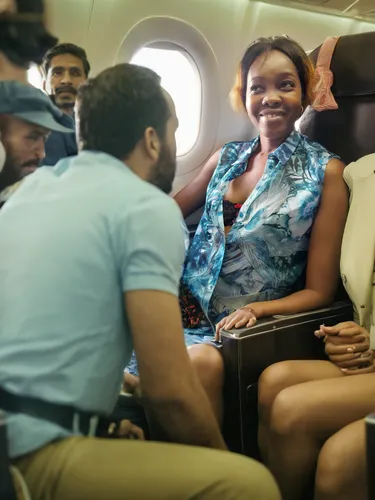 flight attendant,airplane passenger,air new zealand,passengers,stewardess,travel insurance,business jet,bussiness woman,airline travel,travel woman,jetblue,corporate jet,advertising campaigns,aircraft cabin,china southern airlines,air travel,african businessman,in seated position,nigeria woman,african woman