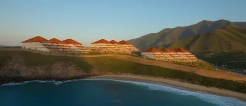 a view from above of some beautiful buildings on the coast,amanresorts,napali,over water bungalows,resorts,hotel nacional,windward,Photography,General,Realistic