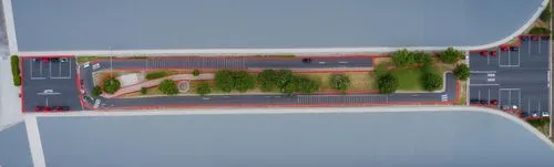 Lo rojo son adoquines ya que es un estacionamiento. en el  interior tiene dos camineras en los laterales de piedra color gris, es un parque lineal,superhighways,dji spark,trackir,bicycle lane,highway 