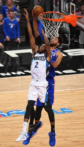 Andrew Wiggins of the Minnesota Timberwolves and World team goes up for a dunk in the second half against Jahlil Okafor of the Philadelphia Sixers...,dunker,air block,cauderon,no call,riley two-point-