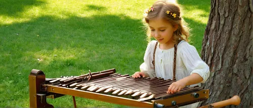 Write a lighthearted story about a child playing a cheerful tune on a metallophone in a sunny park.,hammered dulcimer,xylophone,pan flute,wooden instrument,dulcimer,autoharp,block flute,folk instrumen