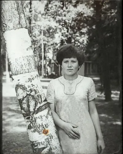 older woman in floral print top with eyeglasses,girl with tree,girl holding a sign,tereshkova,skater,skateboard,vintage children