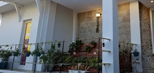 зона отдыха и барбекю,a couple of plants on a balcony near the door,facade,house facade,interhostel,elderhostel,nazimabad,verandas,Photography,General,Realistic