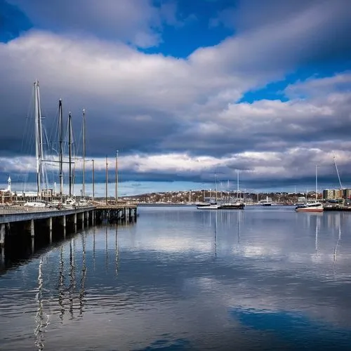 Halifax, Nova Scotia, Canada, architectural design, modern building, glass facade, steel structure, angular lines, urban landscape, cityscape, waterfront, pier, harbour, sailboats, seagulls, cloudy sk