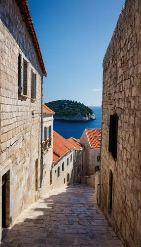 Dubrovnik old town, medieval architecture, red-tiled roofs, white stone buildings, narrow cobblestone streets, ancient city walls, fortifications, towers, Gothic windows, ornate doorways, balconies wi