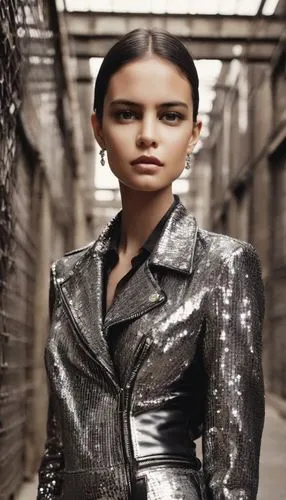 a woman in silver and black standing outside,menswear for women,editorials,edun,proenza,woman in menswear,womenswear