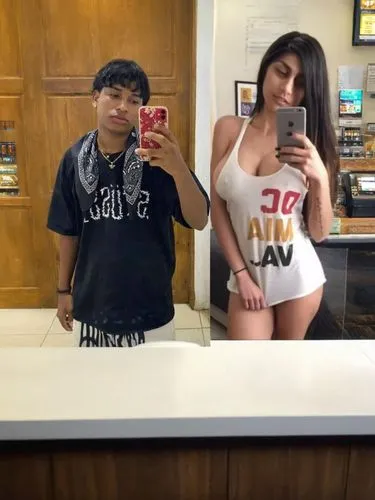 two people on a beach posing for a picture,tyga,tittabawassee,xxl,cardizem,titterrell,thighpaulsandra