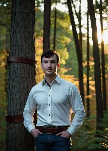 Mature man, husband, Bailey Jay, 30s, strong facial features, short brown hair, stubble, gentle smile, warm eyes, white shirt, dark blue jeans, leather belt, black boots, standing, nature, forest, tre