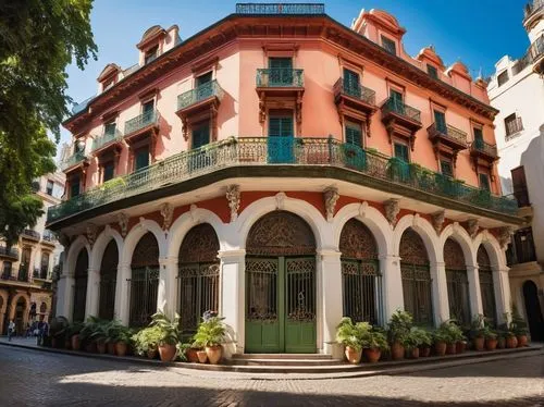 Colonial Argentinian style building, grand entrance with ornate gates, intricate stone carvings, balconies with iron railings, red-tiled roofs, ornate wooden doors, large windows with shutters, vibran