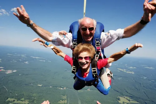 Eleanor Cunningham smiles after safely landing with tandem master Dean McDonald at Saratoga Skydiving Adventures, in Gansevoort, N.Y., a day after her 100th birthday. It was her third jump, after taki