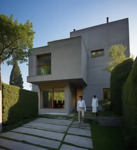 The sleek silhouette of a futuristic house is accentuated by the bold, thick hues of green contrasting against the fierce backdrop of a tall, earthy building. The streets below are dark and shrouded, 