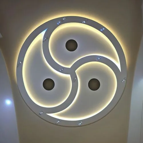 Gypsum decoration in the ceiling of a room with hidden LED lighting the ceiling,a beautiful room with some lights on the ceiling,ceiling light,enersis,spiracle,wall light,triskelion,spiralis