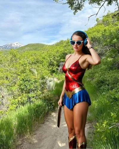 a woman is posing in a superhero costume and headphones,wonderwoman,wonder woman,superheroine,super heroine,wonder woman city,super woman