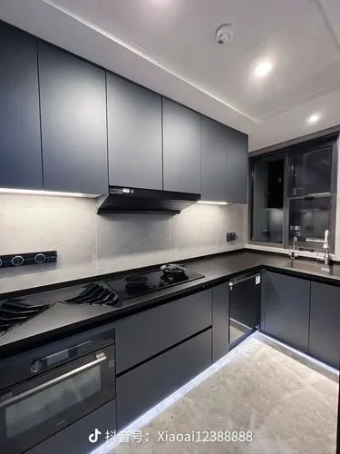 dark cabinets,modern kitchen interior,modern kitchen,dark cabinetry,modern minimalist kitchen,kitchen design,kitchen interior,new kitchen,polished granite,under-cabinet lighting,kitchen cabinet,kitche