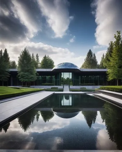 Modern crematorium, futuristic architecture, sleek lines, glass facade, metallic accents, somber atmosphere, dim lighting, peaceful surroundings, lush greenery, memorial gardens, water features, fount