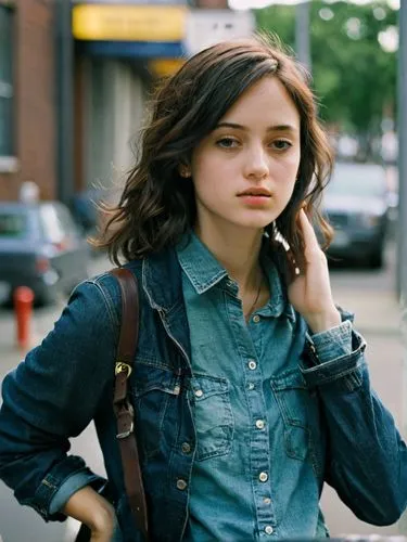 A valuable high-resolution photograph in which the depth of field really comes into its own.,a girl on the phone standing in front of a street sign,dennings,scodelario,caterino,jehane,hamulack,on the 