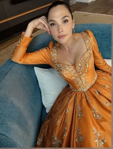 Dress high quality,a woman with brown hair sits in a blue couch wearing a gold gown,kebaya,margairaz,cheongsam,ao dai,phuquy,qipao