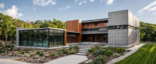 rehabilitation center with steel construction and natural materials on facades,modern house,modern architecture,cube house,exposed concrete,dunes house,corten steel,cubic house,mid century house,conte