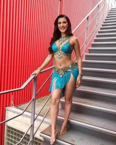 belly dancer,a woman standing on top of stairs wearing a bikini top and skirt,wonderwoman,kitana,themyscira,wonder woman city,kalani,asian costume,amazona,lavani,caribana,kamini kusum,moana,wonder wom