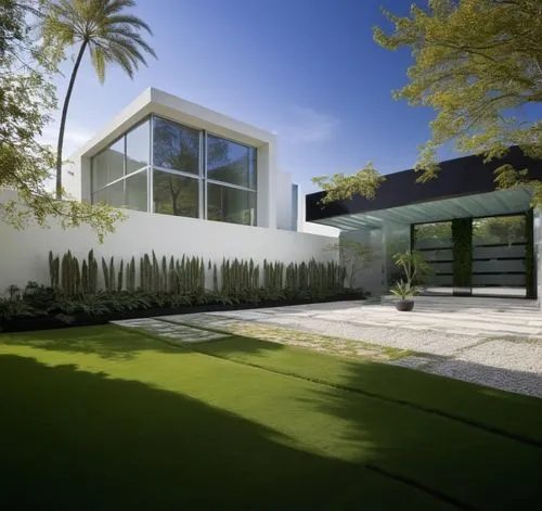 Diseño exterior de una casa moderna estilo minimalista combinando muros de color blanco con muros de tabique aparente, herrería de aluminio con cristal, fotografía hiperrealista, fotografía arquitectó