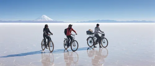 Salar de Uyuni in Bolivia is the biggest salt flat in the world. three friends and their bikes. friends cycling.,salt-flats,salt flats,salt flat,salar de uyuni,salt desert,the salar de uyuni,cross-cou