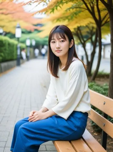 young japanese woman sits on a bench,a young woman sitting on top of a wooden bench,mikiko,hiromi,eriko,manaka,kaori,ayami