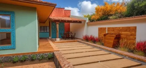 REMODELACION DE UNA CASA CON ESTILO MEXICANO, USO DE COLORES VIVOS, MADERA, PISOS DE BARRO, FLORES Y UN ESPEJO DE AGUA CON FUENTE EN UN MURO,an outdoor deck has flowers in the raised beds,patios,vivie