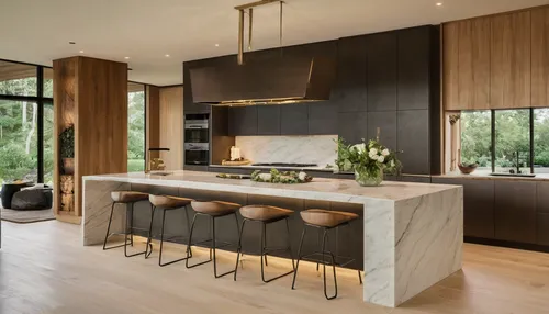 Thrilled to unveil my latest kitchen design, a space where contemporary luxury meets the serenity of nature. I've harmonized sleek, dark cabinetry with the natural elegance of Calacatta marble, captur