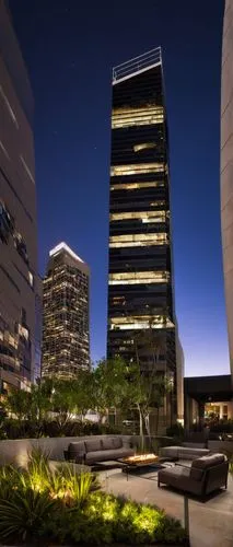 Modern Desarc Design office building, Los Angeles CA 90064, urban cityscape, skyscraper, glass facade, steel structure, sleek lines, minimalist exterior, rooftop garden, outdoor seating area, city lig