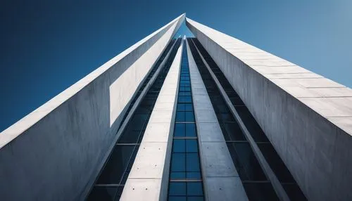 Massing in Architecture, modern building, abstract structure, geometric shapes, white concrete, clean lines, minimalist design, urban landscape, cityscape, blue sky, few clouds, dramatic shadows, low-