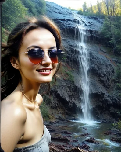 there is a woman standing in front of a waterfall,waterfalls,waterfall,water fall,brown waterfall,cachoeira,ilse falls,sanaya,balija,avantika,kaaterskill,fallingwater,water falls,live in nature,artvin