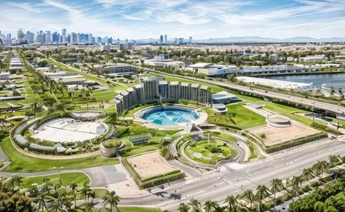 sunny day, pedestrians walking, palm trees, trees, grassy large land area, freeway behind, distant mountains behind,sharjah,qlizabeth olympic park,abu dhabi,ekaterinburg,abu-dhabi,dubai garden glow,du