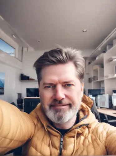 as an artist smiling, taking a selfie in the office of the city of Sochi, in winter, bright sun, blue sky and small clouds,stehlík,video call,videokonferenz,podjavorník,kapparis,brhlík,community manag