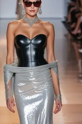 قماش جلد اسود,model walking down runway in silver dress with silver cape and glasses,mugler,roitfeld,moschini,siriano,latex,leatherette