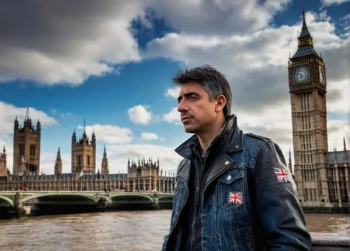 Male photographer, 30s, casual wear, denim jeans, black leather jacket, Nikon camera, UK flag patch, standing, looking up, architectural landmark, London cityscape, Big Ben clock tower, Westminster Br