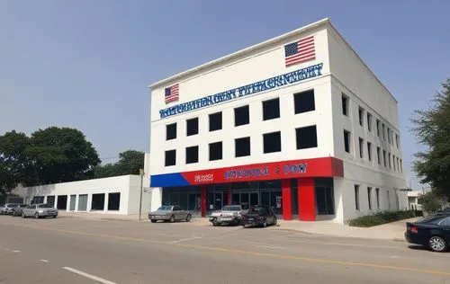 a large white building with a red, blue and green flag on the side,carquest,commercial hvac,fire and ambulance services academy,headquarters,company headquarters,houston fire department,bond stores,wi