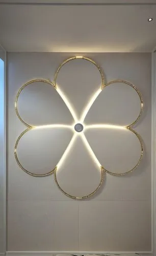 Gypsum decoration in the ceiling of a room with hidden LED lighting,a modern bathroom with a flower shaped decoration,ceiling light,wall light,ceiling lamp,wall lamp,luminous garland,gold stucco frame