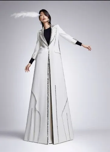 a woman in white clothing standing on a grey background,homogenic,yohji,pharmacopeia,tonghe,zoroastrian novruz,kunqu,Photography,Fashion Photography,Fashion Photography 14