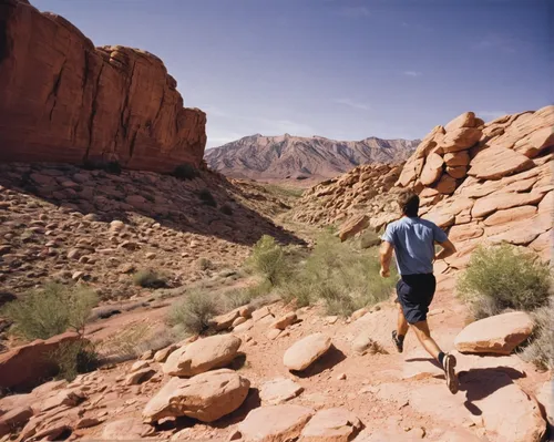 USA, Utah, St. George, Man running in rocky landscape,valley of fire state park,ultramarathon,valley of fire,red rock canyon,timna park,trail running,wadirum,desert run,al siq canyon,bright angel trai