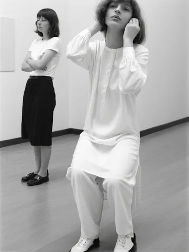 Two different women.,two women in white outfits, one sitting on the floor,butoh,baguazhang,eurythmy,qigong,zwirner,durational,Photography,Black and white photography,Black and White Photography 03