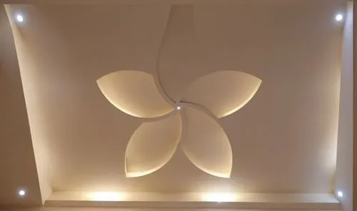 Gypsum decoration in the ceiling of a room with hidden LED lighting the ceiling,the ceiling in a very modern room that has been decorated,ceiling light,ceiling lamp,wall lamp,wall light,ceiling lighti