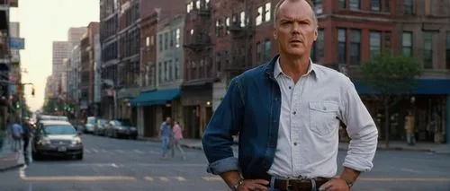 Michael Keaton, middle-aged man, iconic beard, salt and pepper hair, bright blue eyes, wrinkles on forehead, relaxed facial expression, casual wear, white shirt, dark blue jeans, brown leather belt, b